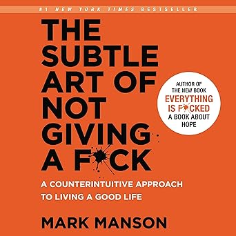 The Subtle Art of Not Giving a Fck book cover in bold orange with minimalist design.